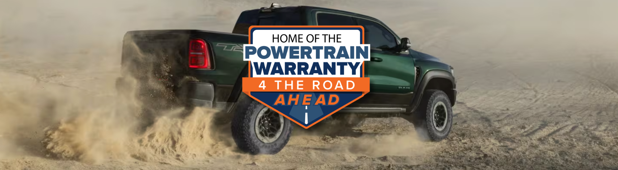 Green 2026 RAM 1500 TRX spinning sand in the desert with a Home of the Lifetime Powertrain Warranty logo